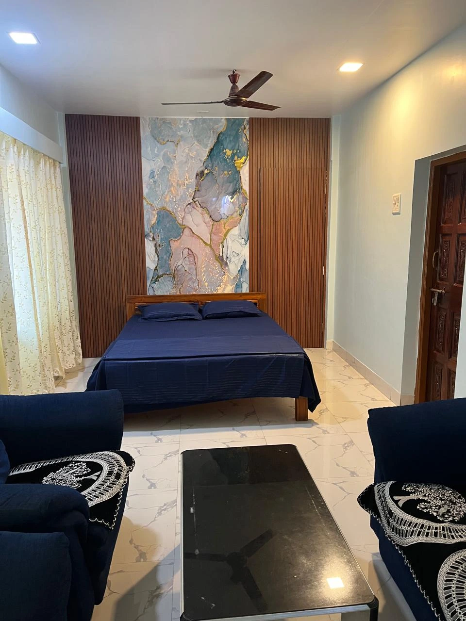 Deluxe family room with pool view at Dolphin House beach resort Nagaon Alibaug