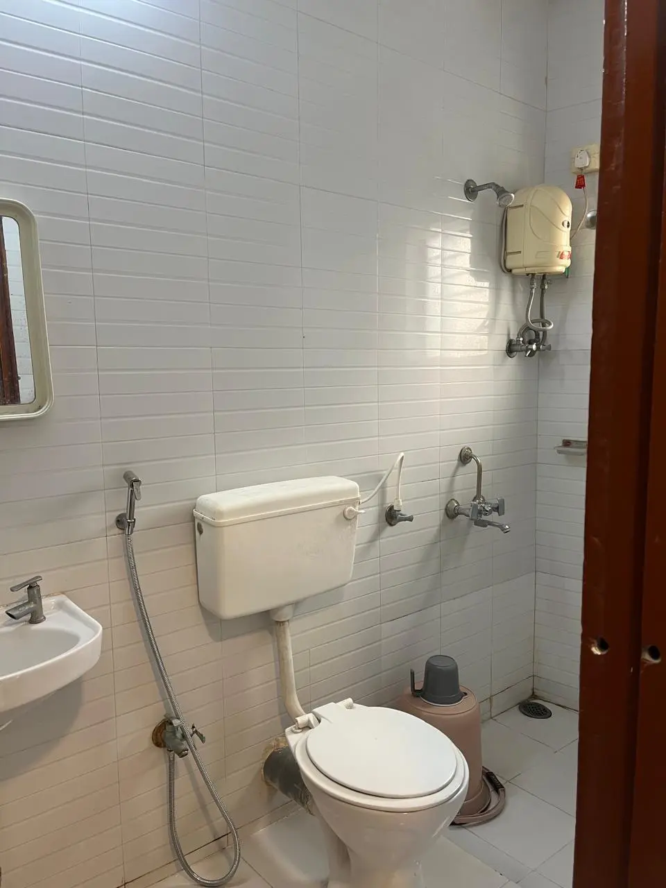 Attached bathroom in guest room at Dolphin House beach resort Nagaon Alibaug