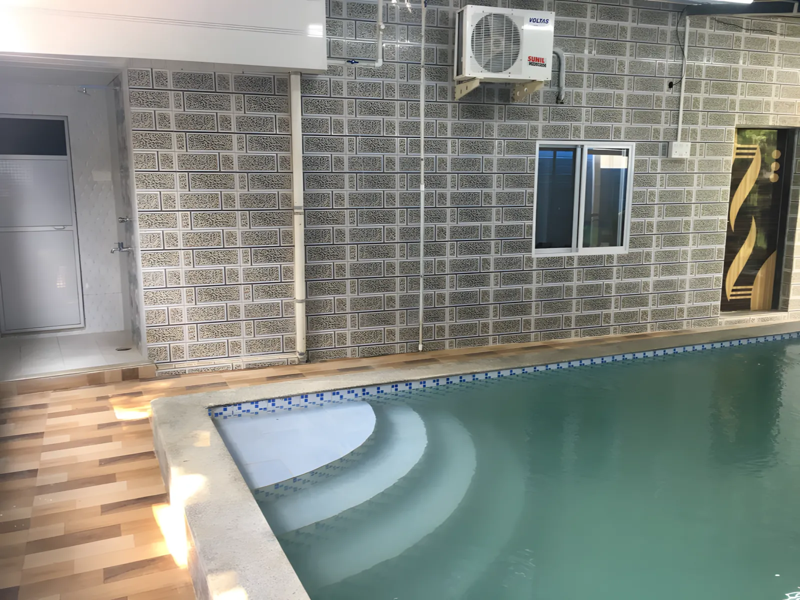 Indoor swimming pool at Dolphin House beach resort Nagaon Alibaug