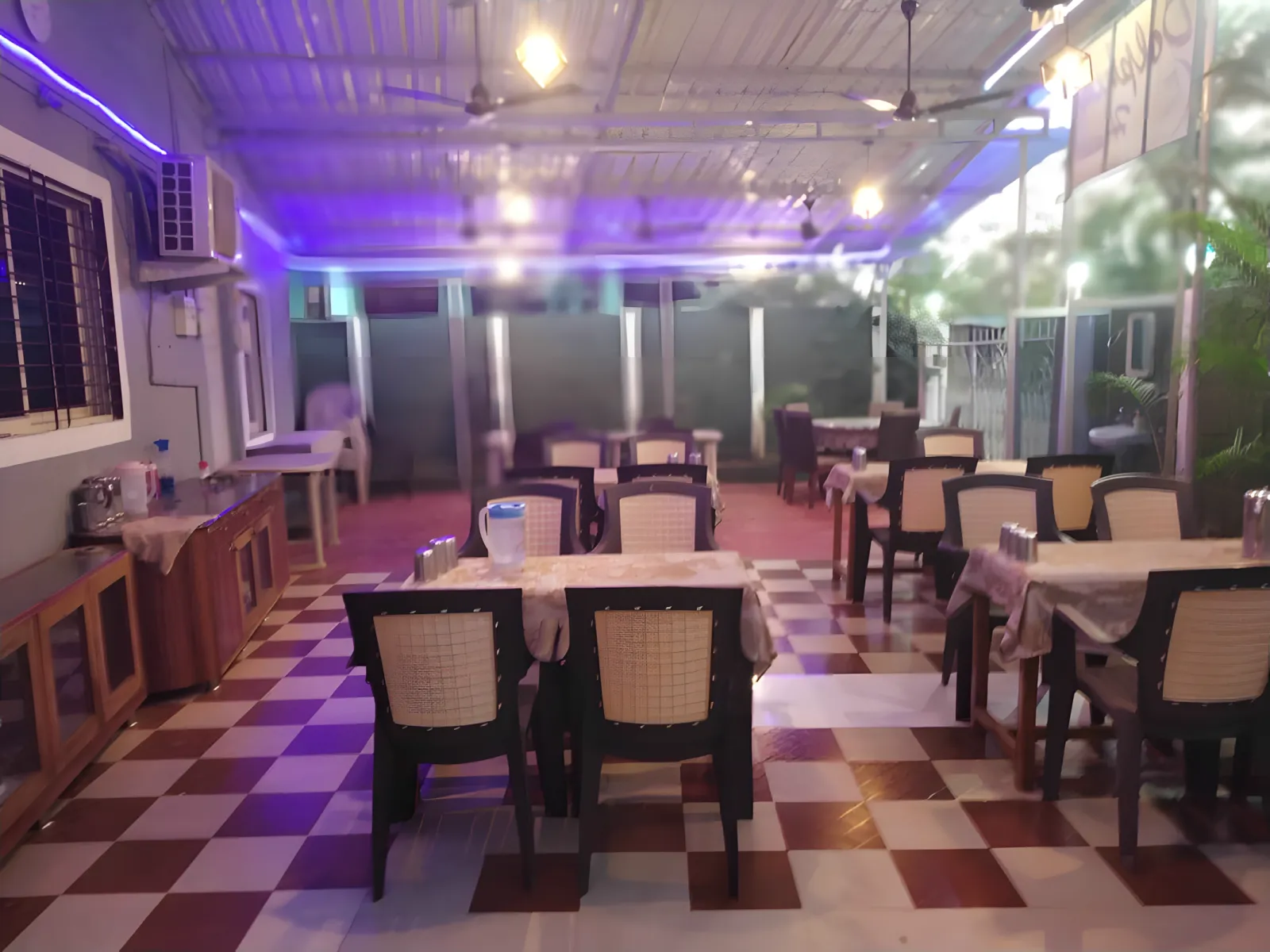 Dining area at Dolphin House for group meal plans in Nagaon