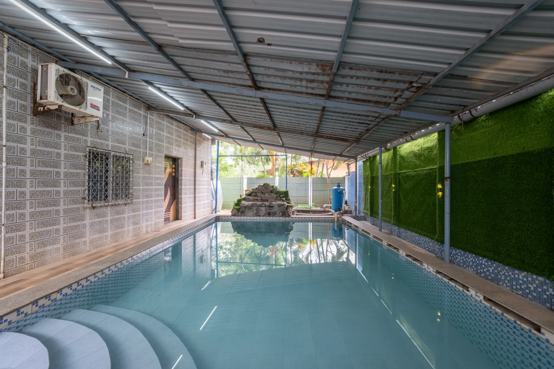 Another view of the swimming pool at Dolphin House Beach Resort in Nagaon Alibaug